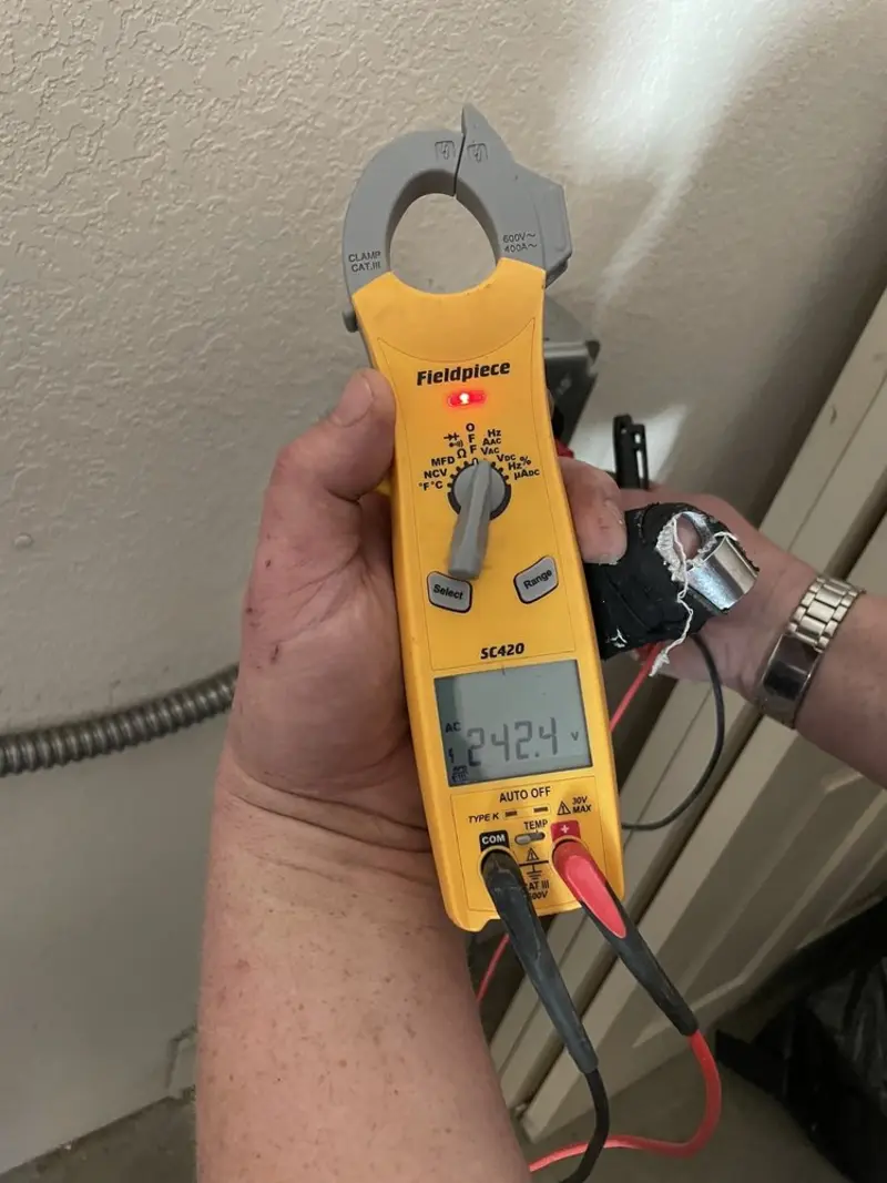 Voltage testing with clamp meter during Whole House Surge Protector in Richwood